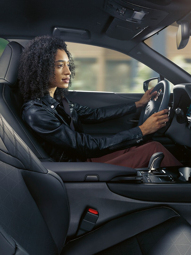 woman driving a Lexus car