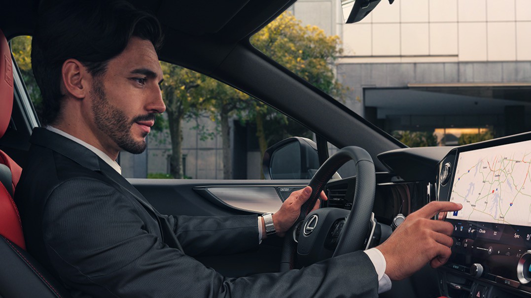 man driving inside a Lexus car