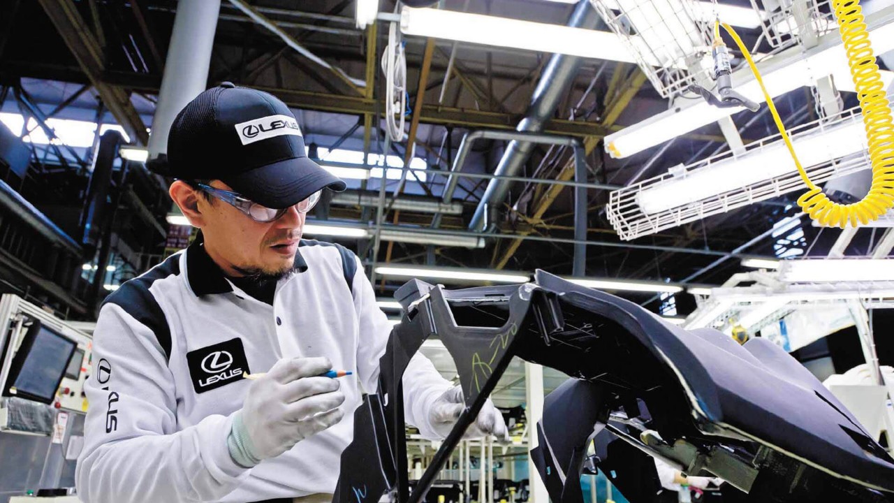 man working on a Lexus vehicle