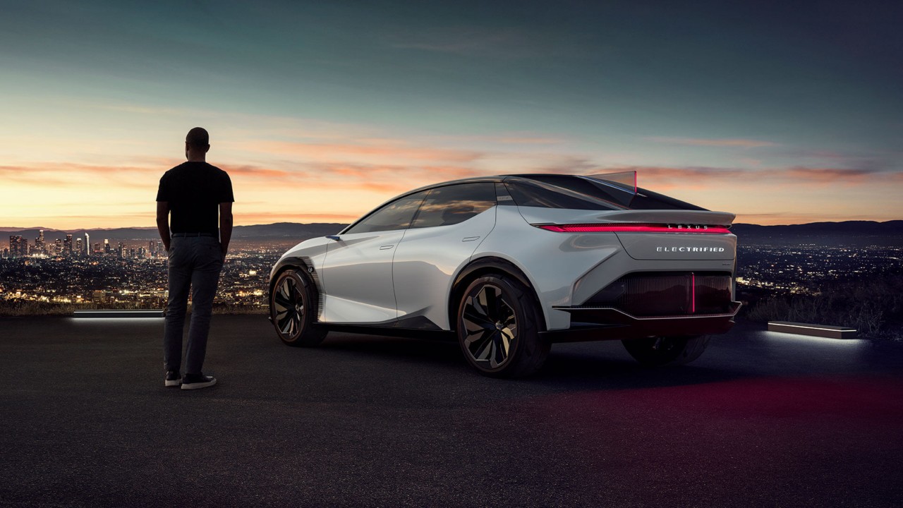 man standing next to a Lexus LF-Z Electrified