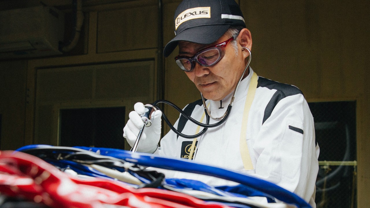 Lexus man working on a car in a factory