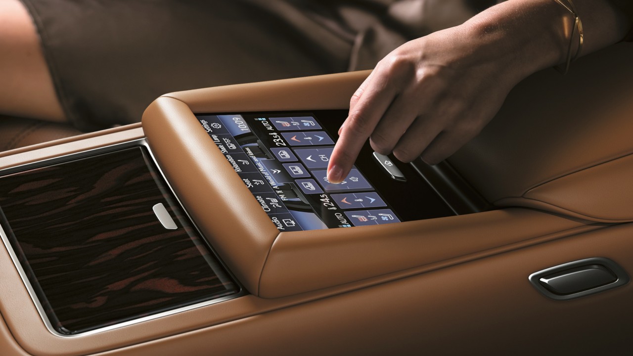 person using their finger to use a Lexus touchpad
