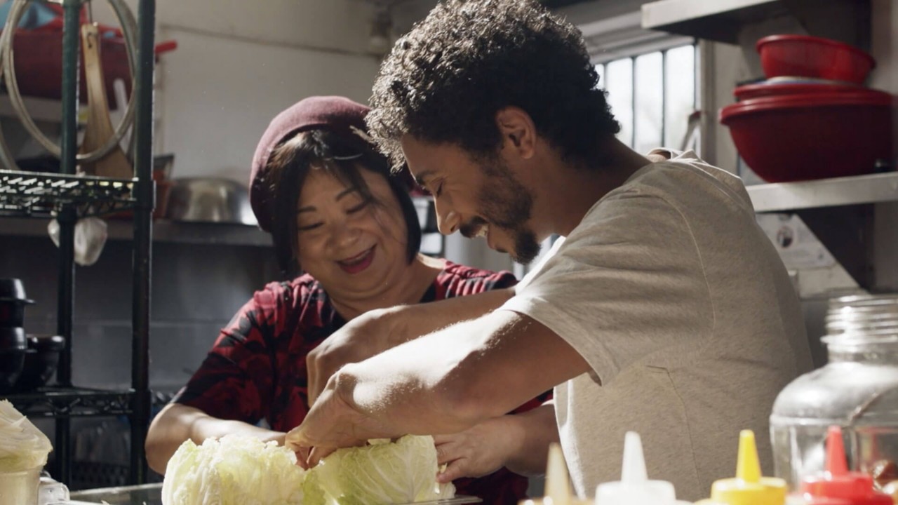 Miles Thompson cooking with his mother