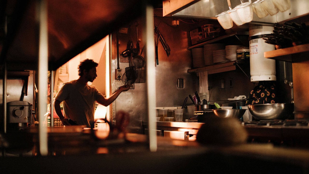 Miles Thompson standing in a kitchen