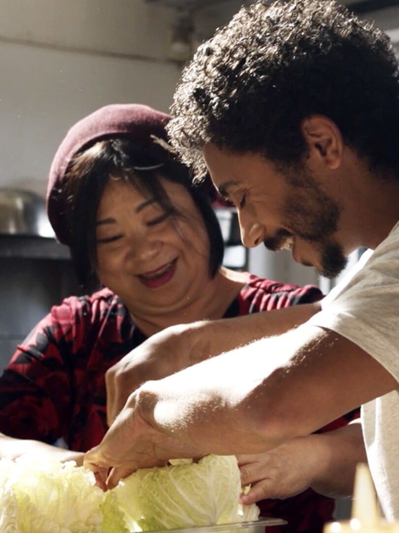 Miles Thompson cooking with his mother