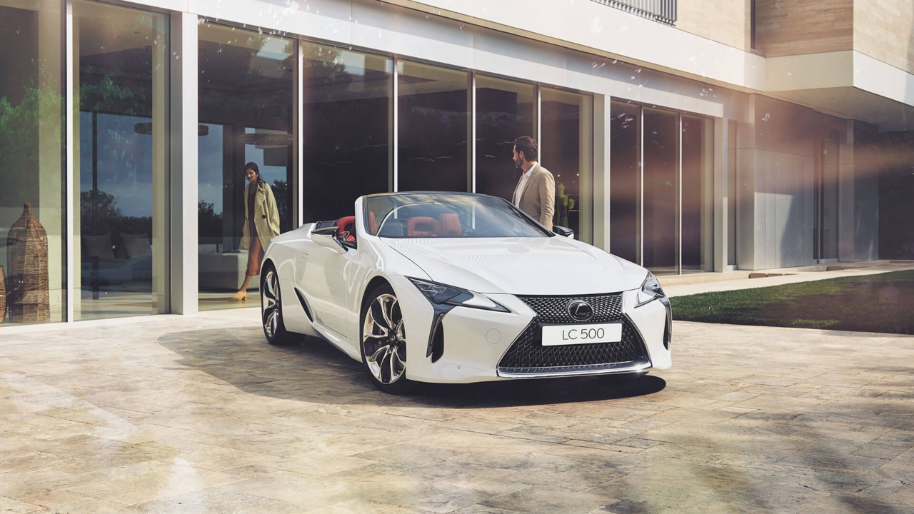 two people approaching the Lexus LC Convertible