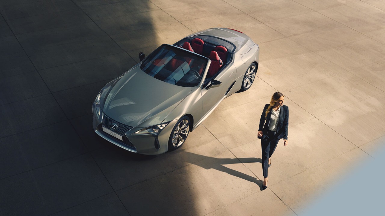 aerial shot of person walking away from the Lexus LC Convertible