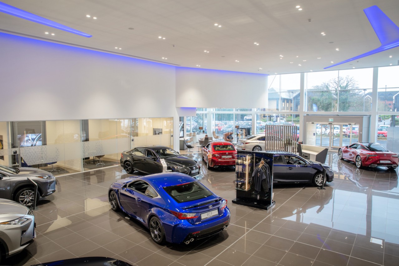 a variety of Lexus cars in a showroom