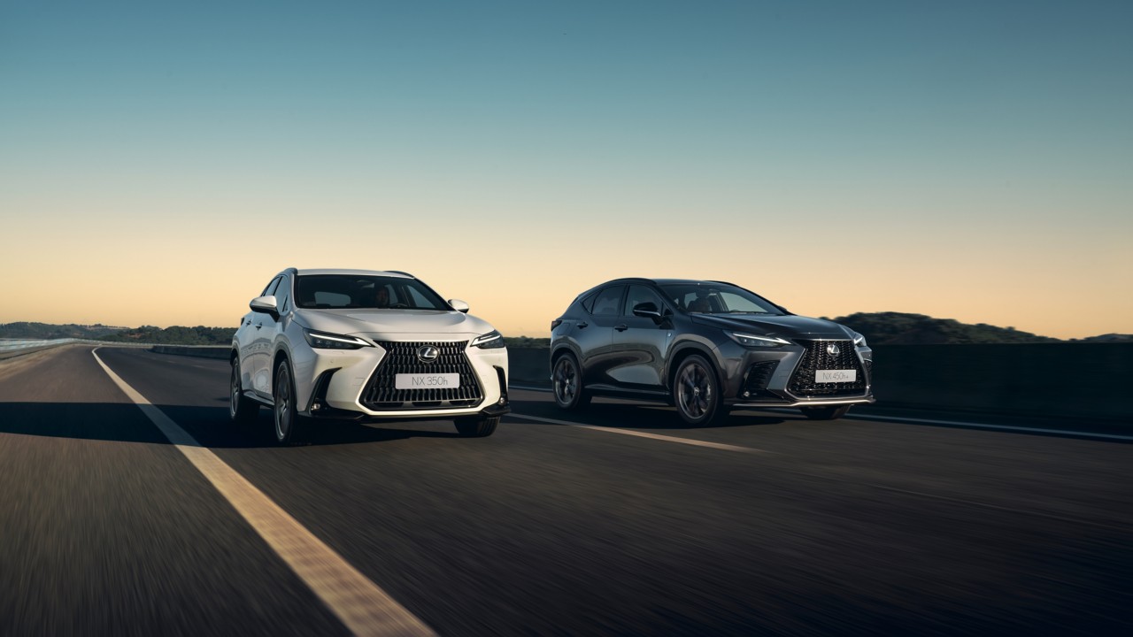 two Lexus NX cars driving on a road