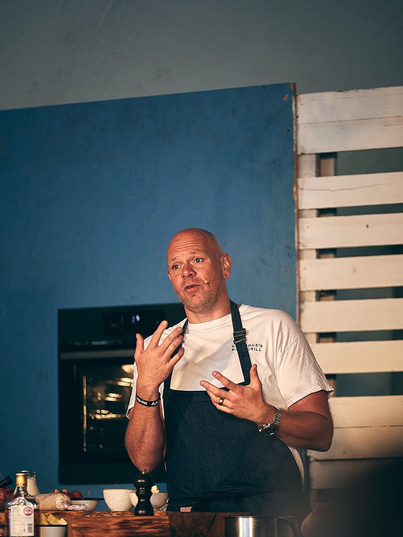 Tom Kerridge cooking in a kitchen