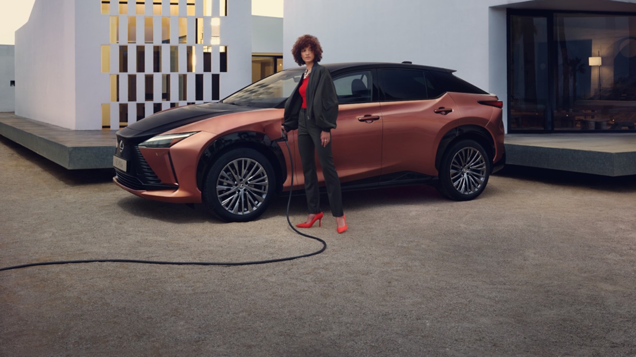 person charging a Lexus UX 300e car