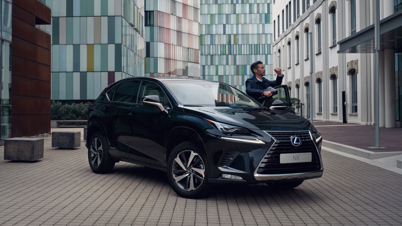 man coming out of a Lexus NX