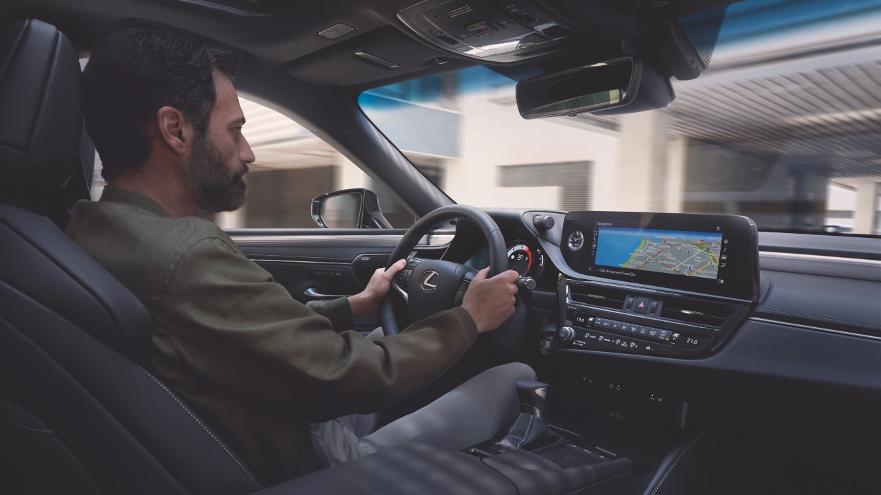 man driving a Lexus ES