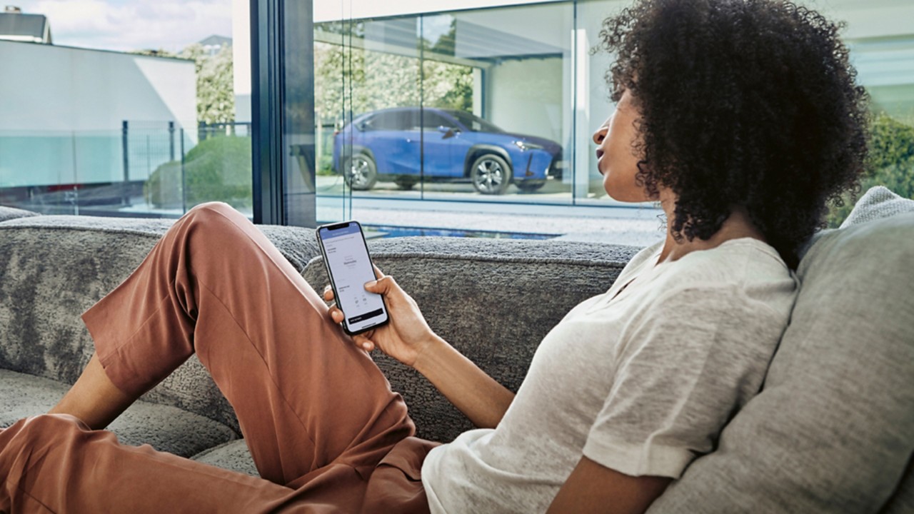 woman on phone at Lexus dealers