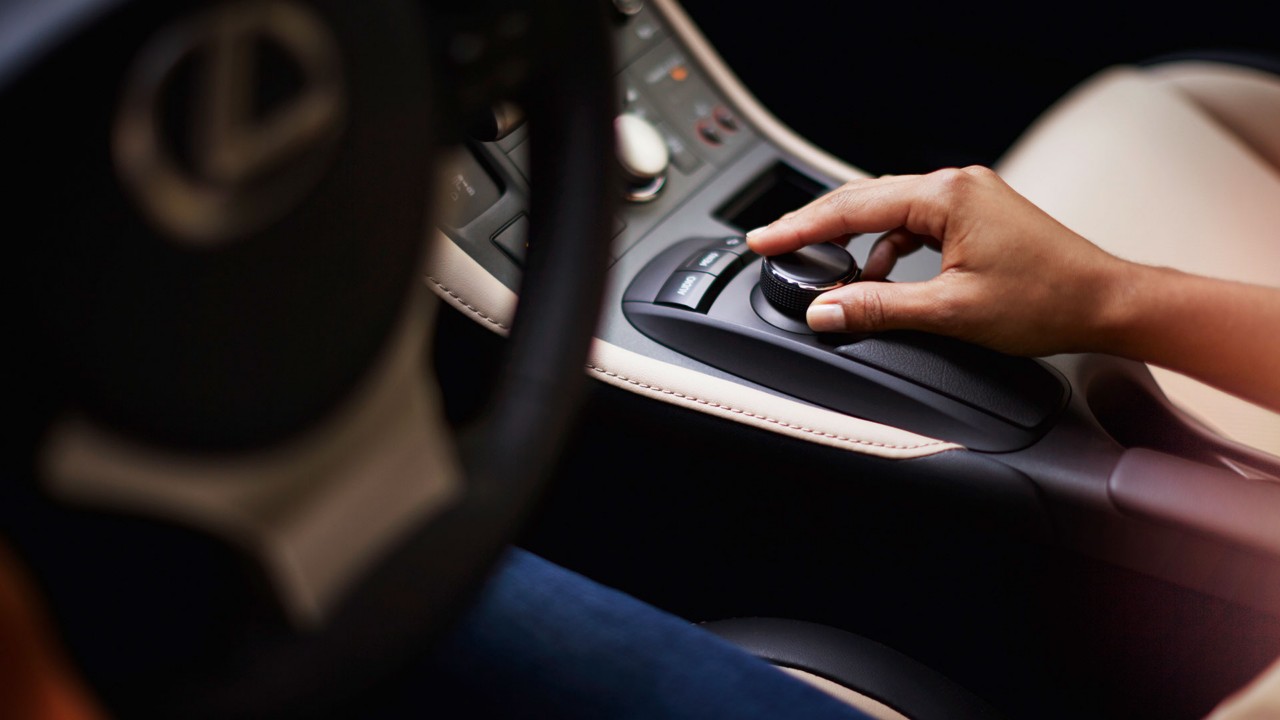 person using a dial inside a Lexus CT 200h