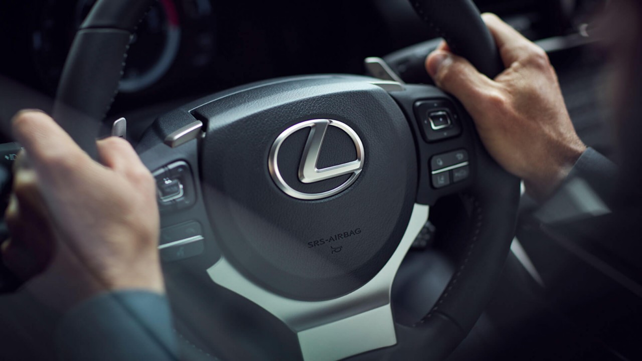 Lexus IS two hands on a steering wheel