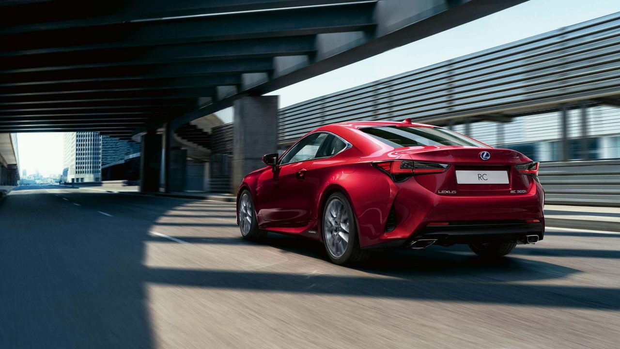 back shot of a Lexus RC driving down a road