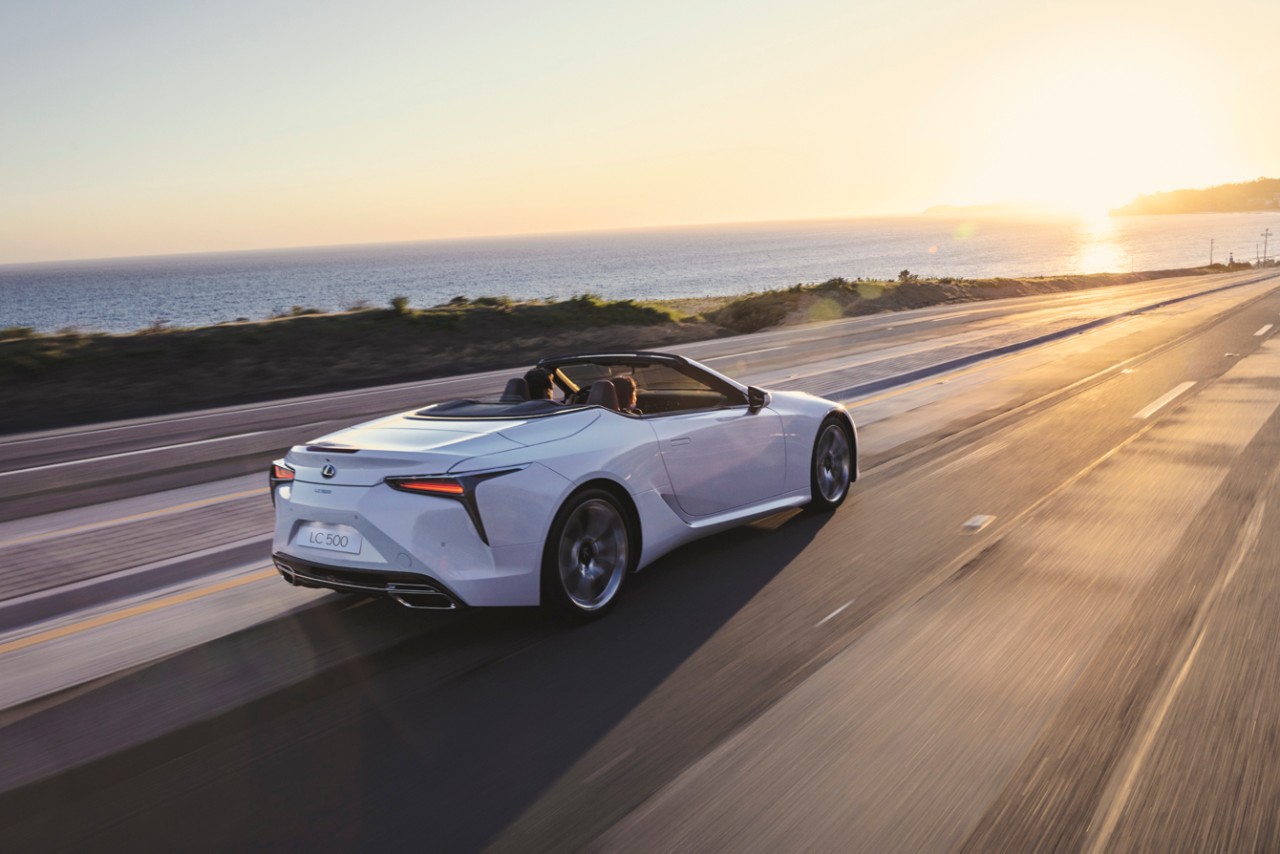 Lexus LC Convertible driving down a road