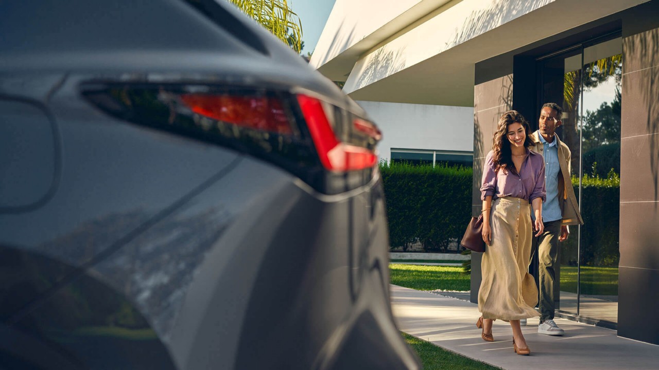 Woman next to Lexus car