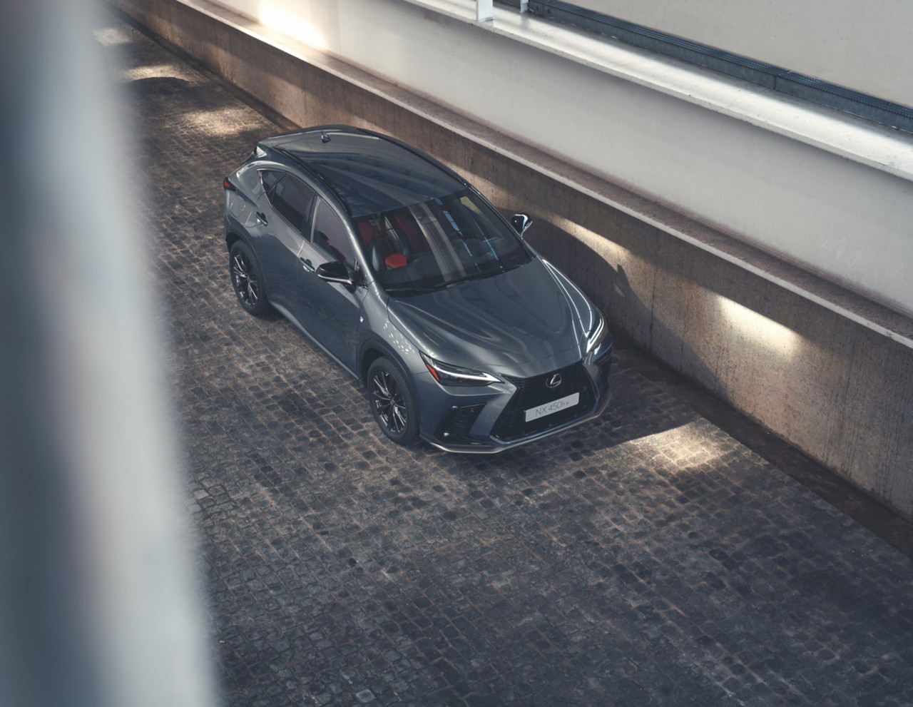 Lexus NX driving down a corridor