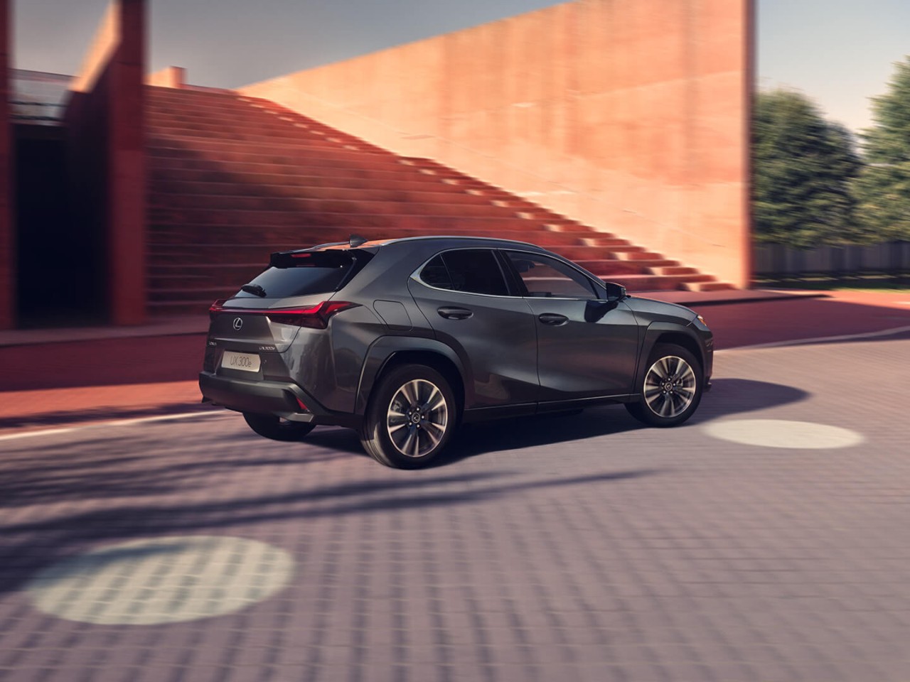 person pressing a button inside their Lexus UX 300e