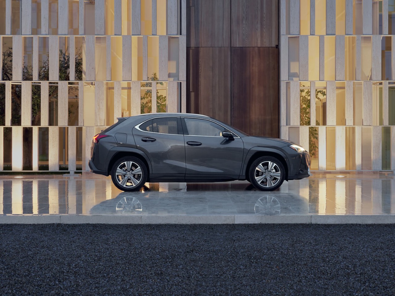 person pressing a button inside their Lexus UX 300e