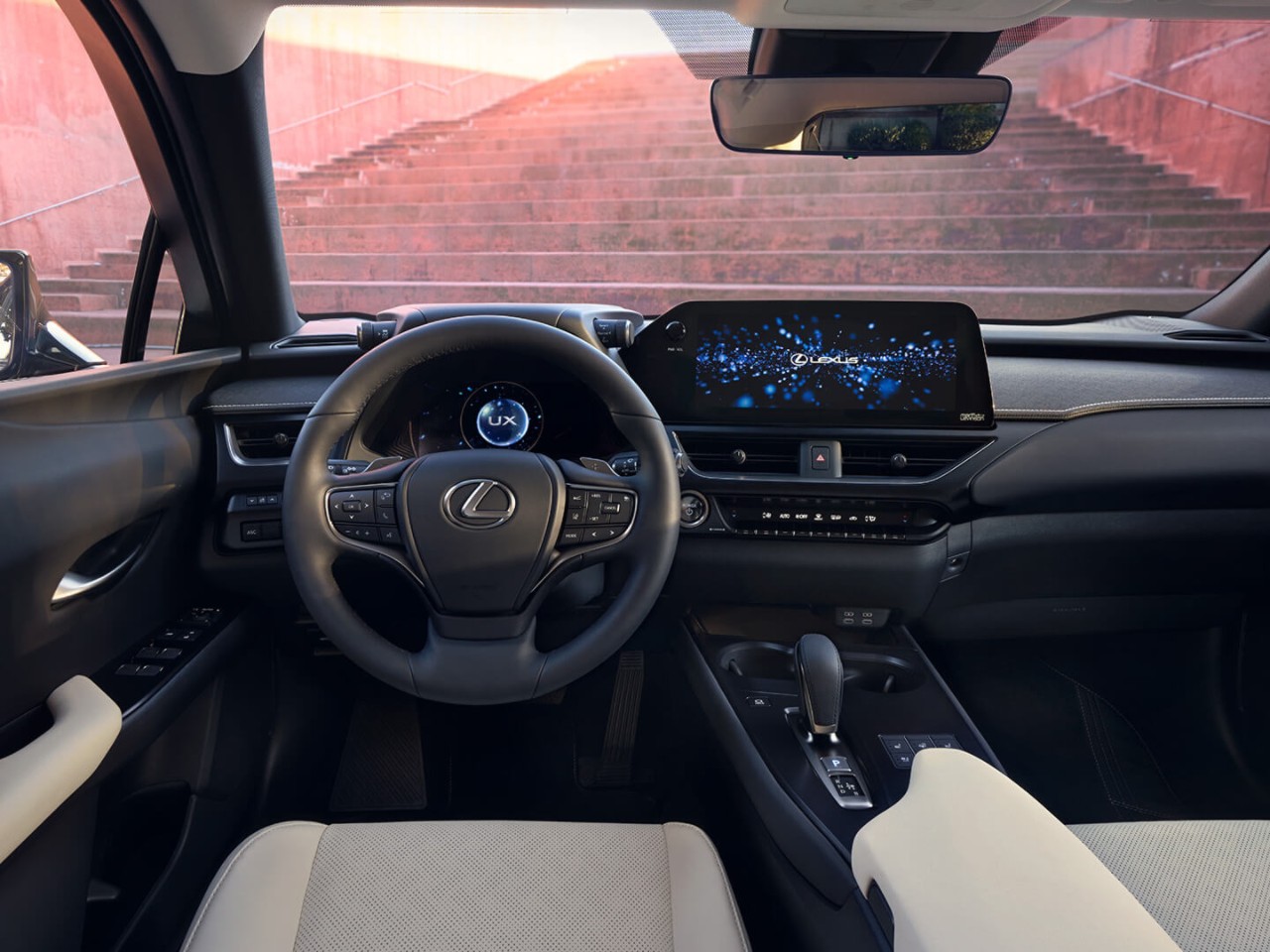 person pressing a button inside their Lexus UX 300e