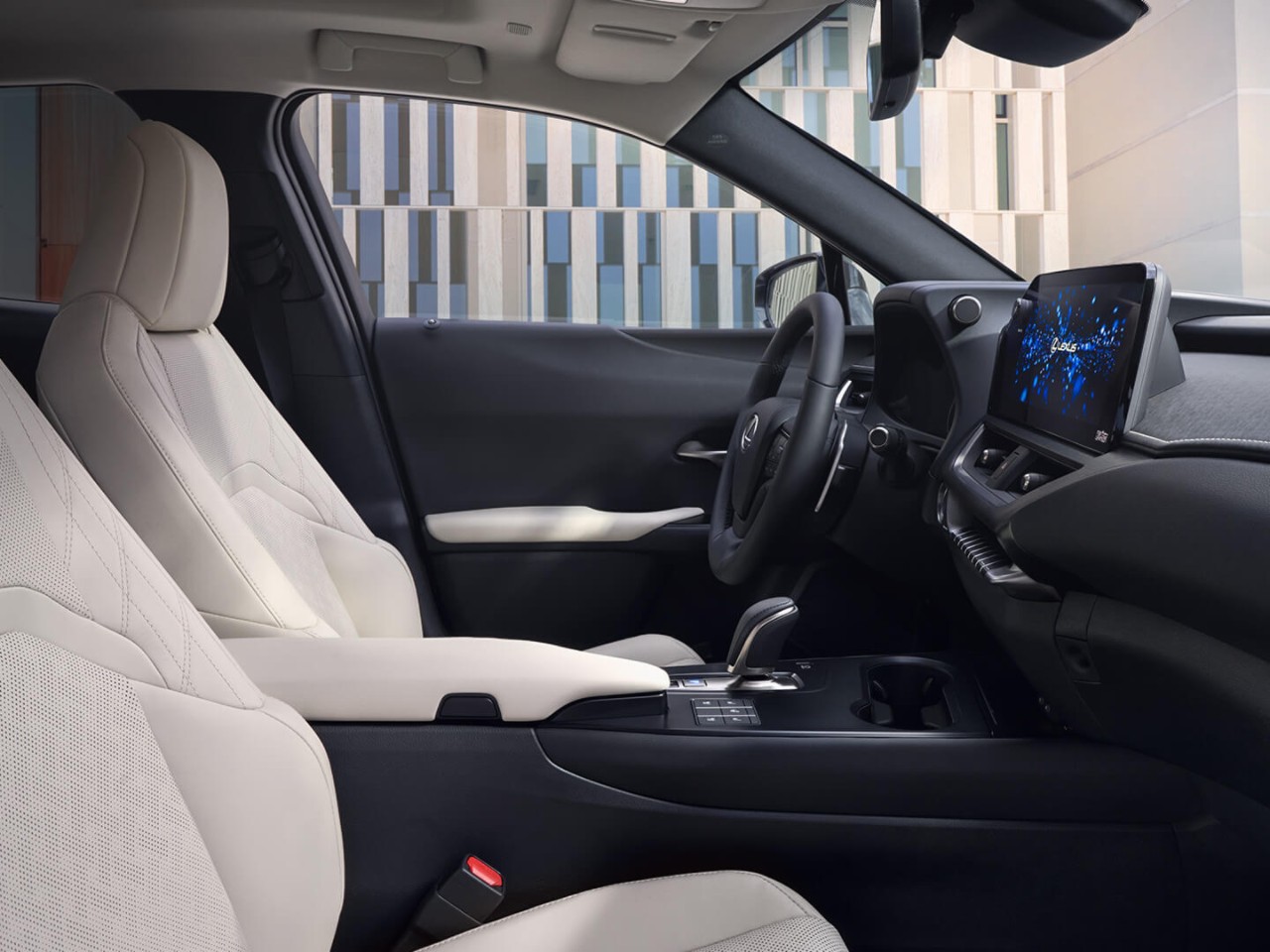 person pressing a button inside their Lexus UX 300e