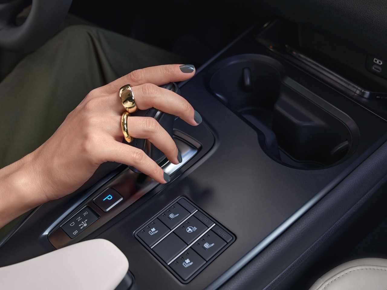 person pressing a button inside their Lexus UX 300e