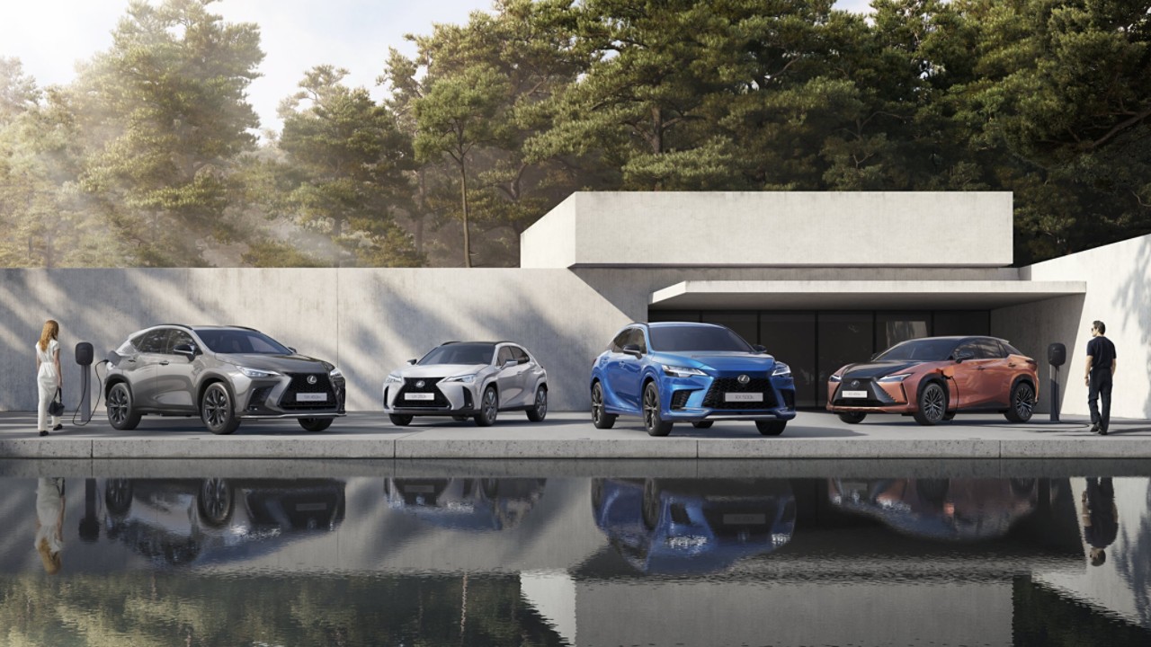 collection of Lexus cars parked outside a office