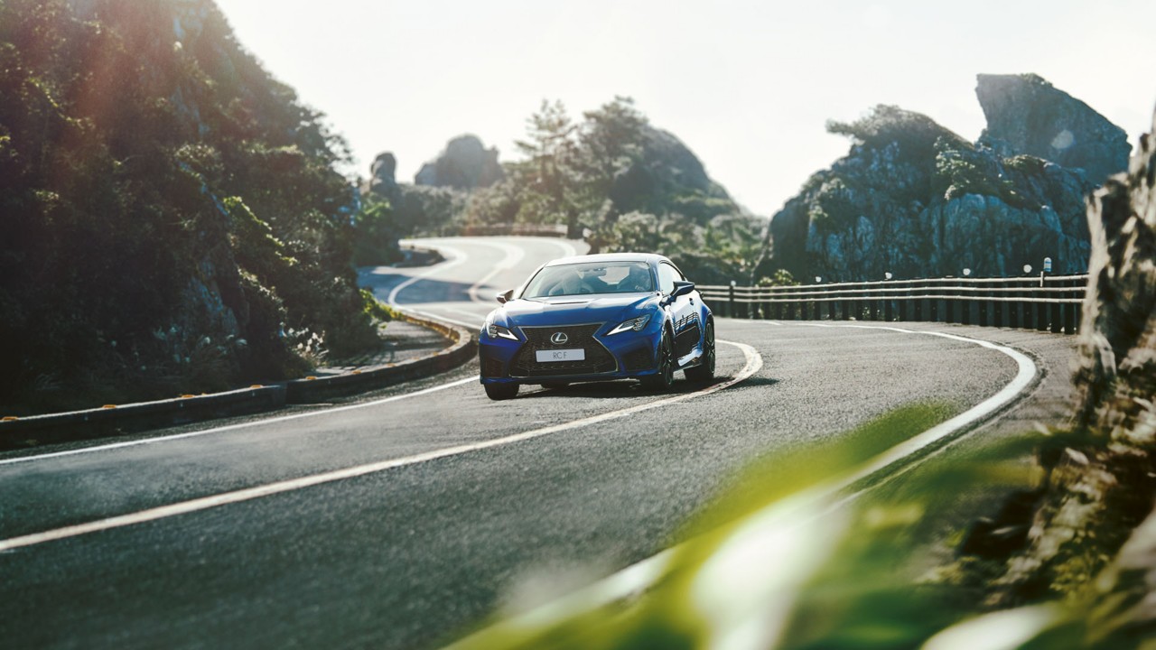 The Lexus RC F driving on a mountain road