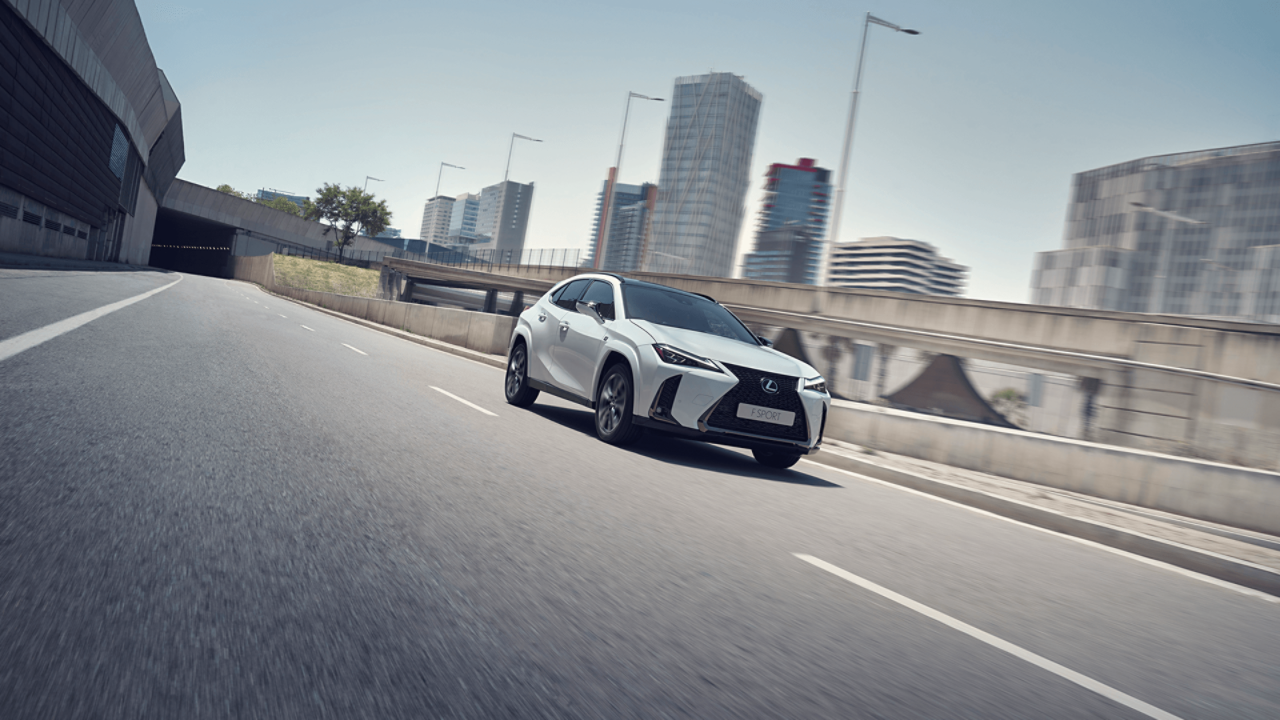  Lexus UX driving in a city