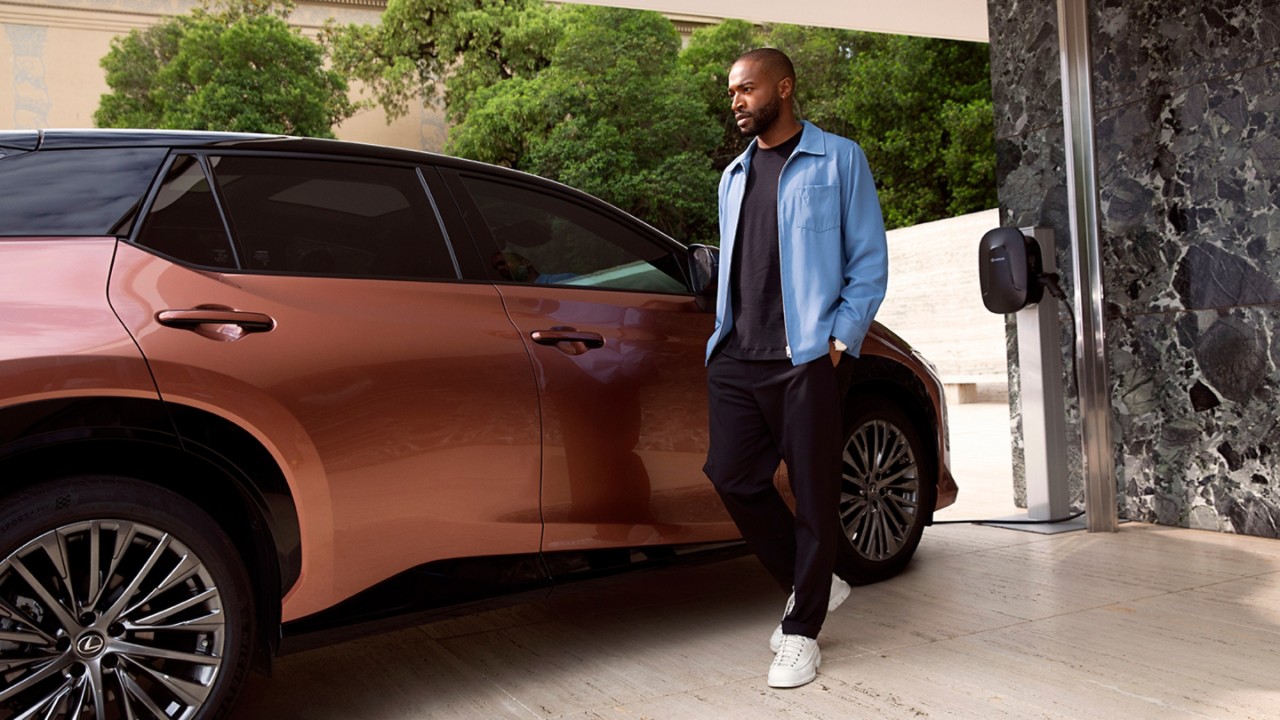 person stood next to Lexus RZ